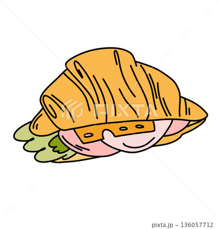 A fragrant croissant, sliced and stuffed with ham and cheese, on crisp greens. German breakfast. 136057712