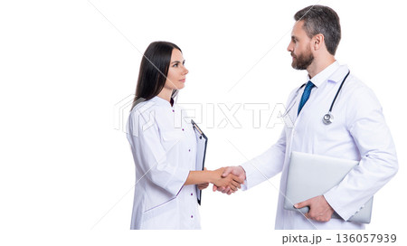Handshake, agreement on patient health. hospital teamwork collaboration. successful treatment. doctor handshake with nurse. two doctor shaking hands isolated on white. copy space 136057939
