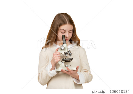 School biology girl hold microscope. Student of biology. Back to school. Teen girl with microscope isolated on white. Biology science for schoolgirl. Microscope research. Biology experiment School biology girl hold microscope. Student of biology. Back to school. Teen girl with microscope isolated on white. Biology science for schoolgirl. Microscope research. Biology experiment 136058184