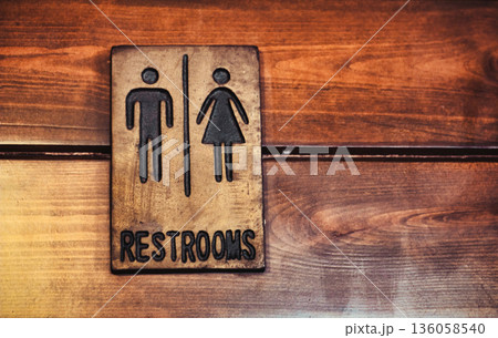A restroom bathroom sign with traditional male and female symbols 136058540