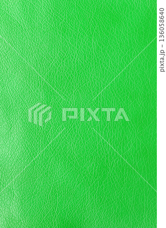 Texture of genuine leather, artificial leatherette green background 136058640
