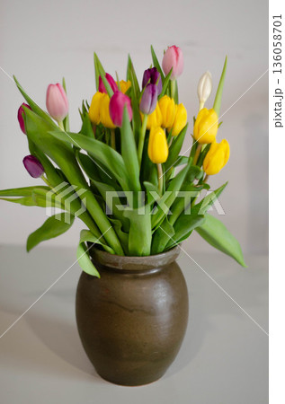 Colorful Spring Tulips Bouquet in Ceramic Vase 136058701