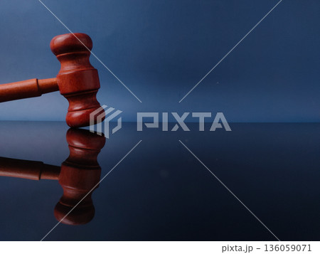 The object shown is a gavel, a small ceremonial mallet typically made of hardwood. The object shown is a gavel, a small ceremonial mallet typically made of hardwood. 136059071