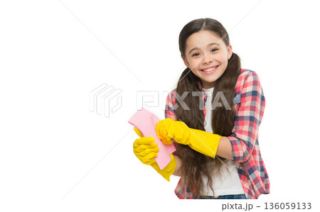 Yellow glove for cleaning. duster helpful for wiping dust. happy kid use duster and cleaning gloves. small girl yellow rubber protective gloves ready to clean. Household duties. Dish wash gloves Yellow glove for cleaning. duster helpful for wiping dust. happy kid use duster and cleaning gloves. small girl yellow rubber protective gloves ready to clean. Household duties. Dish wash gloves 136059133