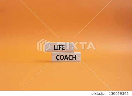 Life Coach symbol. Concept word Life Coach on wooden blocks. Beautiful orange background. Business and Life Coach concept. Copy space Life Coach symbol. Concept word Life Coach on wooden blocks. Beautiful orange background. Business and Life Coach concept. Copy space 136059341