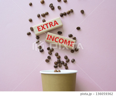 Extra Income symbol. Concept words Extra Income on beautiful wooden picture frame. Beautiful pink background with coffee cup and coffee beans. Business and Extra Income concept. Copy space. Extra Income symbol. Concept words Extra Income on beautiful wooden picture frame. Beautiful pink background with coffee cup and coffee beans. Business and Extra Income concept. Copy space. 136059362