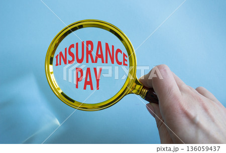 Insurance Pay symbol. Magnifying Glass with words Insurance Pay. Businessman hand. Beautiful blue background. Business and Insurance Pay concept. Copy space. Insurance Pay symbol. Magnifying Glass with words Insurance Pay. Businessman hand. Beautiful blue background. Business and Insurance Pay concept. Copy space. 136059437