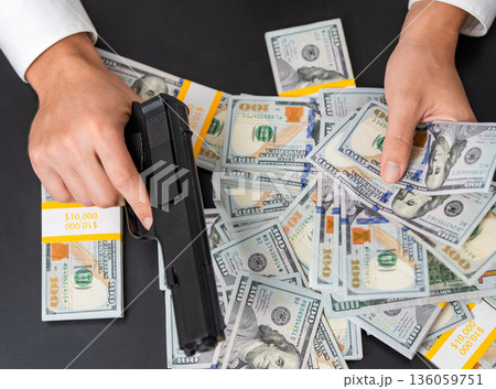 Armed robber crime deal. Thief killer do robbery, mafia. Gun with money. Criminal crime theft. Hand with gun and dollar banknote, deal threaten. Robber with gun taking money. Criminal taking money 136059751
