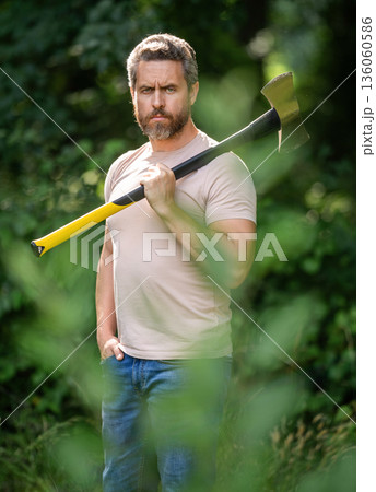 Brutal lumberjack. Brutality and masculinity. Hispanic lumberjack man with axe. Lumberjack axe. Man with logging axe. Hardworking brutal man. Lumberjack hardworking outdoor, selective focus 136060586