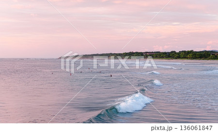 Avellanas Beach surfers enjoying sunset tropical waves 136061847