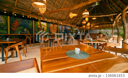 Tropical restaurant creating a jungle theme relaxing atmosphere Tropical restaurant creating a jungle theme relaxing atmosphere 136061853