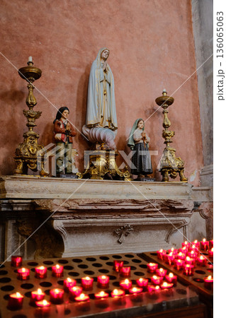Igreja Sao Domingos Lisbon fire damaged church interior red vaulted ceiling stone columns golden altar historic cathedral Portugal. High quality photo 136065063