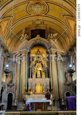 Baroque church interior with gilded altar ornate nave columns arches and ceiling fresco Lisbon Portugal. High quality photo Baroque church interior with gilded altar ornate nave columns arches and ceiling fresco Lisbon Portugal. High quality photo 136065079
