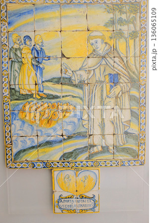 St Anthony chapel details wrought iron gates corridor stair tile panel and information plaques inside historic complex Lisbon Portugal editorial set. High quality photo 136065109