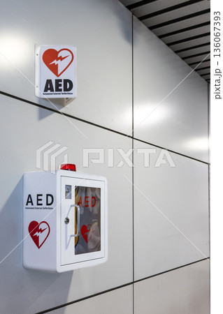 AED or Automated External Defibrillator installed on wall of public places as first aid in heart attack situation. With copy space. AED or Automated External Defibrillator installed on wall of public places as first aid in heart attack situation. With copy space. 136067393