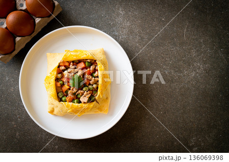 egg wrap or stuffed egg with minced pork and vegetable egg wrap or stuffed egg with minced pork and vegetable 136069398