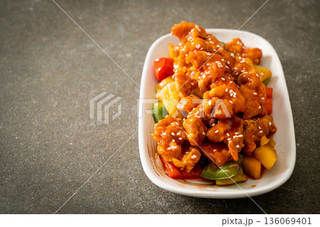 fried crispy chicken with sweet and sour sauce 136069401