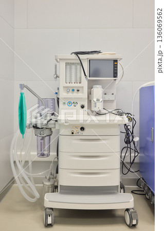 Medical infusion equipment, Clinical infusion pump with calibration features, Healthcare infusion system mounted on clean wall with adjustable flow and pressure controls 136069562