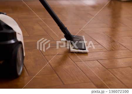 Professional parqueting cleaning visuals, Ecofriendly vapor cleaning for wooden floors, Scene showcasing deep cleaning technology with vapor and steaming effect on wooden flooring Professional parqueting cleaning visuals, Ecofriendly vapor cleaning for wooden floors, Scene showcasing deep cleaning technology with vapor and steaming effect on wooden flooring 136072100