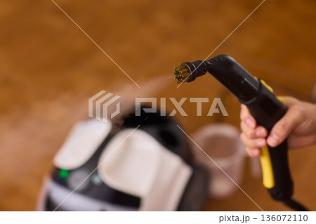 Hot vapor cleaning, Modern household cleaner using hot vapor for sanitization purposes, Device emits heated steam through brush to disinfect and refresh household surfaces 136072110