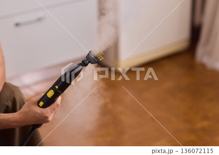 Hot vapor cleaning, Modern household cleaner using hot vapor for sanitization purposes, Device emits heated steam through brush to disinfect and refresh household surfaces 136072115