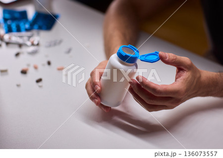Pharmacist organizing medication bottles, Medical technician managing pill containers efficiently, Clinical staff ensuring proper storage and safety of pharmaceutical supplies Pharmacist organizing medication bottles, Medical technician managing pill containers efficiently, Clinical staff ensuring proper storage and safety of pharmaceutical supplies 136073557