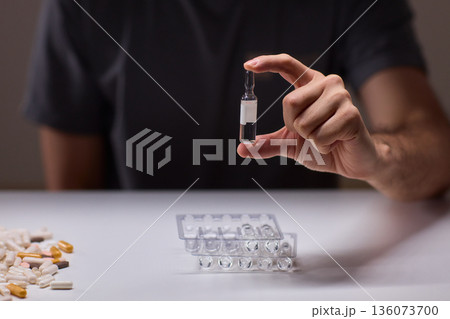 Cleaning and mixing medicines with precision craftsmanship, Detailed scene of meticulous drug processing involving tablet grinding and precise pharmaceutical handling Cleaning and mixing medicines with precision craftsmanship, Detailed scene of meticulous drug processing involving tablet grinding and precise pharmaceutical handling 136073700