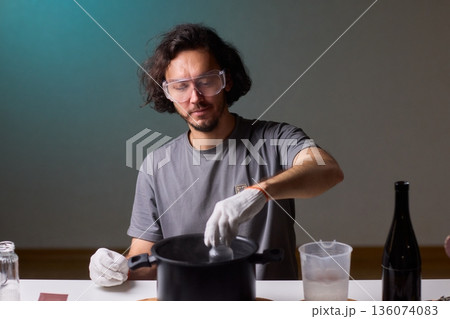 Precise technique for transforming bottles into functional decor pieces, Detailed method of utilizing heat and protective gear to repurpose glass containers into decorative items 136074083