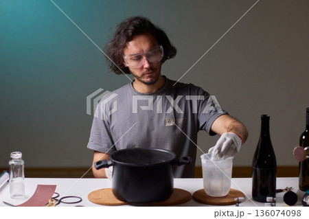 Precise technique for transforming bottles into functional decor pieces, Detailed method of utilizing heat and protective gear to repurpose glass containers into decorative items 136074098