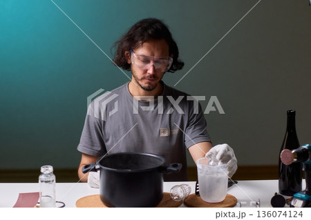 Precise technique for transforming bottles into functional decor pieces, Detailed method of utilizing heat and protective gear to repurpose glass containers into decorative items 136074124