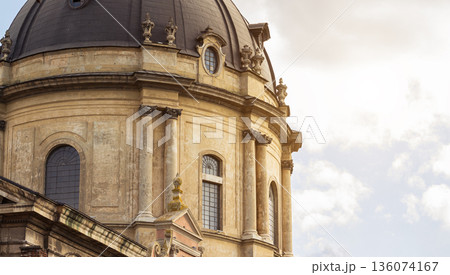 cathedral dome catholic church facade close up medieval architecture high rise building European sightseeing tourism heritage site panoramic view with dramatic cloudscape background cathedral dome catholic church facade close up medieval architecture high rise building European sightseeing tourism heritage site panoramic view with dramatic cloudscape background 136074167