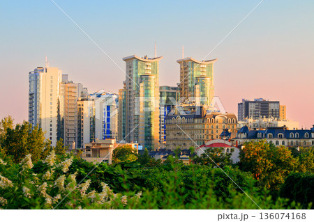 colorful majestic Megapolis landmark city scape view of Ukrainian capital Kyiv business center corporate buildings skyscraper architecture morning sun rise atmospheric vivid spring season time  136074168