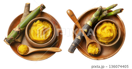 Pandanus fruit paste in wooden bowl with fresh pandanus leaves and fruit on wooden plate, isolated on white transparent background 136074405