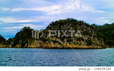 beautiful view of island and sea with clear sky background, West Papua, Indonesia beautiful view of island and sea with clear sky background, West Papua, Indonesia 136076104