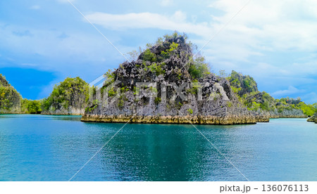 beautiful view of island and sea with clear sky background, West Papua, Indonesia beautiful view of island and sea with clear sky background, West Papua, Indonesia 136076113