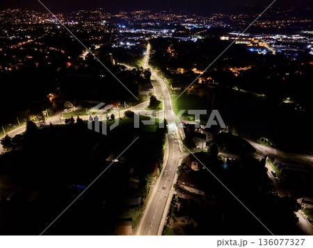 Serene Neighborhood At Dusk, Nighttime Aerial Of Quiet Residential Area With Illuminated Roads Serene Neighborhood At Dusk, Nighttime Aerial Of Quiet Residential Area With Illuminated Roads 136077327