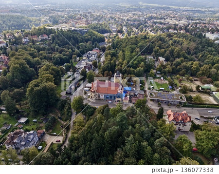 Historic Settlement Amid Green Hills, Traditional Village Surrounded By Lush Woodland Landscapes 136077338