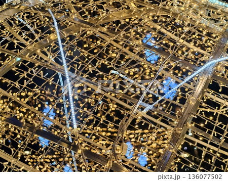 City lights glow, Dynamic nighttime cityscape with colorful illuminated transportation pathways City lights glow, Dynamic nighttime cityscape with colorful illuminated transportation pathways 136077502