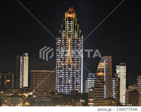 Luminous urban tower, Vivid metropolitan skyline showcasing radiant highrise buildings in city center Luminous urban tower, Vivid metropolitan skyline showcasing radiant highrise buildings in city center 136077506