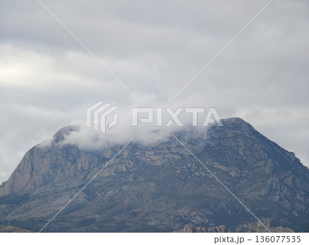 Mystic mountain scene, Calm natural landscape featuring mistcovered volcanic dome and lush surroundings Mystic mountain scene, Calm natural landscape featuring mistcovered volcanic dome and lush surroundings 136077535