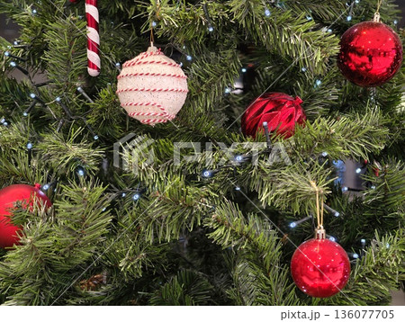 Christmas ornaments with lights, Traditional holiday setup with shiny bulbs and festive accents Christmas ornaments with lights, Traditional holiday setup with shiny bulbs and festive accents 136077705