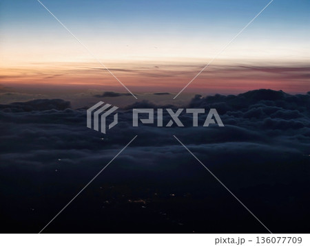 Relaxing twilight scene showcasing pastel shades blending over distant horizon and tranquil sea Relaxing twilight scene showcasing pastel shades blending over distant horizon and tranquil sea 136077709