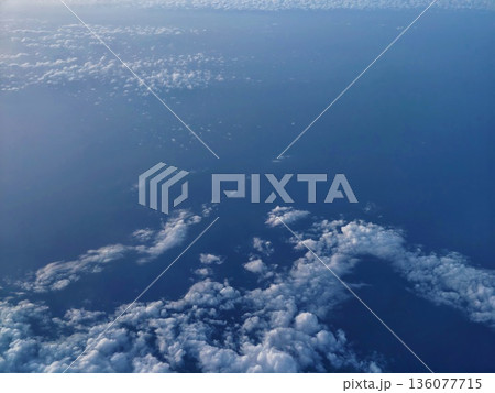 Peaceful sky with clouds, Soothing sky panorama with soft blue shades and cotton clouds during dawn 136077715