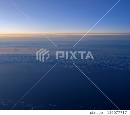 Dawn sky with gentle hues, Tranquil morning scene featuring sparse clouds and expansive sky view Dawn sky with gentle hues, Tranquil morning scene featuring sparse clouds and expansive sky view 136077717