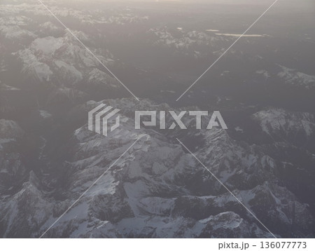 Majestic twilight ridges create stark shadows with subtle sky colors and sense of vast solitude 136077773