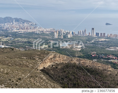 Urban expansion with scenic horizon, Developing residential areas along shoreline with distant hills Urban expansion with scenic horizon, Developing residential areas along shoreline with distant hills 136077856