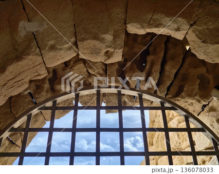 Sky visible through window, Open exterior contrasted with enclosed interior through ornate window frame Sky visible through window, Open exterior contrasted with enclosed interior through ornate window frame 136078033
