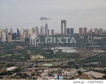 Premium real estate development featuring highrise structures beside tranquil lagoon with natural scenery Premium real estate development featuring highrise structures beside tranquil lagoon with natural scenery 136078083