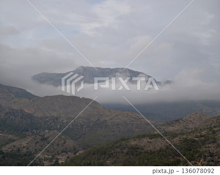 Quiet valleys and distant silhouettes evoke peaceful ambiance perfect for relaxation and exploration Quiet valleys and distant silhouettes evoke peaceful ambiance perfect for relaxation and exploration 136078092