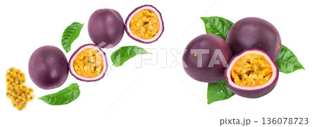 passion fruits and a half with leaves isolated on white background. Isolated maracuya. Top view. Flat lay passion fruits and a half with leaves isolated on white background. Isolated maracuya. Top view. Flat lay 136078723